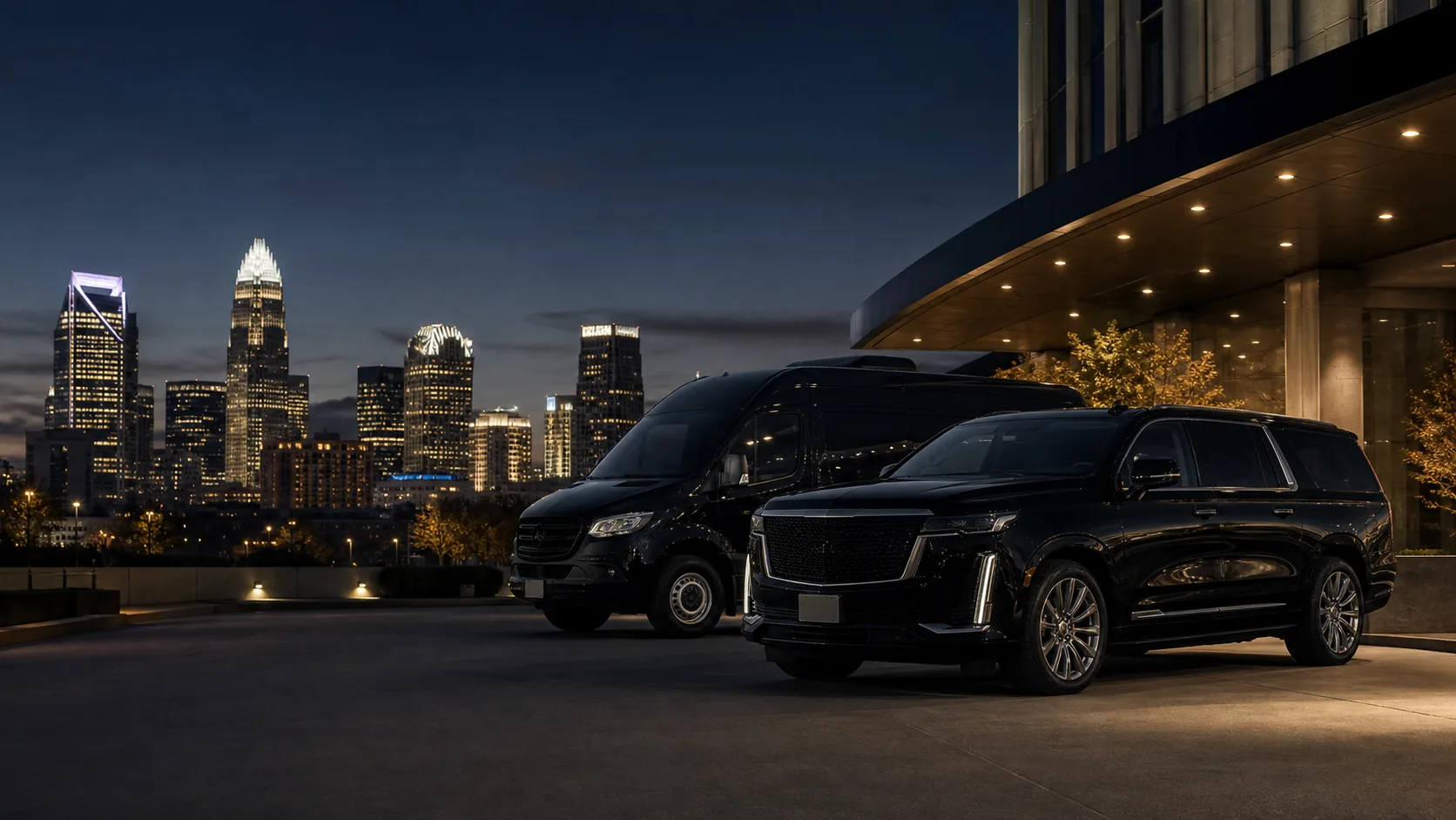 Black executive SUV and Sprinter in front of the Charlotte skyline